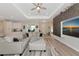 Bright living room featuring a comfortable sofa, mounted TV, and modern decor at 1375 Norwalk Ter, Port Charlotte, FL 33953