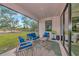 Covered patio with outdoor furniture and a view of the backyard at 1375 Norwalk Ter, Port Charlotte, FL 33953
