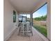 Screened in patio with an outdoor dining area and view to the back yard at 1375 Norwalk Ter, Port Charlotte, FL 33953