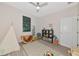 Well-organized playroom with teepee, geometric rug, and ample storage for books and toys at 1375 Norwalk Ter, Port Charlotte, FL 33953