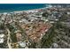 Aerial view of a waterfront community with a pool and meticulously maintained landscaping near the beach at 151 Vista Hermosa Cir # 31C, Sarasota, FL 34242