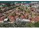 A beautiful aerial shot showcasing the red tile roofs and mature landscaping of this charming villa community at 151 Vista Hermosa Cir # 31C, Sarasota, FL 34242