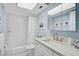 Bright bathroom features a white vanity with countertop and a shower-tub combination at 151 Vista Hermosa Cir # 31C, Sarasota, FL 34242