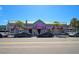 Row of colorful beach shops with awnings and displays, situated along a street with parked cars at 151 Vista Hermosa Cir # 31C, Sarasota, FL 34242