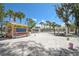 A quaint beachside food concession stand with covered picnic tables on a beautiful sandy beach at 151 Vista Hermosa Cir # 31C, Sarasota, FL 34242