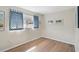 The cozy bedroom with light wood floors features a bright window and simple decor at 151 Vista Hermosa Cir # 31C, Sarasota, FL 34242