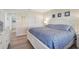 Bedroom features light wood floors, a comfortable bed, and a calming atmosphere at 151 Vista Hermosa Cir # 31C, Sarasota, FL 34242