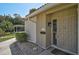 Charming front entrance with a well-maintained landscape and an inviting beige front door at 151 Vista Hermosa Cir # 31C, Sarasota, FL 34242