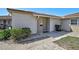 Inviting front entrance showcasing a neatly landscaped yard and a well-maintained exterior at 151 Vista Hermosa Cir # 31C, Sarasota, FL 34242