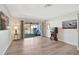 Living room features wood-style flooring and glass doors leading to the outdoor patio at 151 Vista Hermosa Cir # 31C, Sarasota, FL 34242