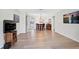 Open-concept living and dining area with wood-style floors, leading to the kitchen at 151 Vista Hermosa Cir # 31C, Sarasota, FL 34242