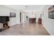 Open living space features wood-style floors and connects to the dining area and kitchen at 151 Vista Hermosa Cir # 31C, Sarasota, FL 34242