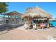 Outdoor tiki bar and patio area, perfect for enjoying a tropical drink in a relaxed beach atmosphere at 151 Vista Hermosa Cir # 31C, Sarasota, FL 34242