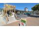 Exterior view of Siesta Poke and Made in Rome Gelato, featuring a pergola and attractive landscaping at 151 Vista Hermosa Cir # 31C, Sarasota, FL 34242
