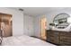 Bright bedroom featuring a dresser and a large walk-in closet at 15152 Cuzcorro Ct, Nokomis, FL 34275