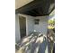 An outdoor entryway that features natural light coming from the door and an above window at 15233 Omaha St, Hudson, FL 34667