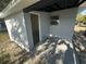 Cement back porch with exterior walls and one window at 15233 Omaha St, Hudson, FL 34667