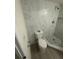 Recently remodeled bathroom showing a commode and shower at 15233 Omaha St, Hudson, FL 34667