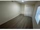 A bright bedroom with closet and light wood floor at 15233 Omaha St, Hudson, FL 34667