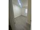 Bedroom with wood flooring and single window at 15233 Omaha St, Hudson, FL 34667
