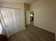 Bedroom featuring new flooring, neutral paint and closet space at 15233 Omaha St, Hudson, FL 34667