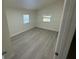 This bedroom provides two windows with wood floors at 15233 Omaha St, Hudson, FL 34667