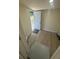 Welcoming entryway with neutral paint and updated flooring, leading to outdoor space at 15233 Omaha St, Hudson, FL 34667