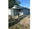 A cozy home with a covered patio area, perfect for outdoor relaxation and enjoying the backyard view at 15233 Omaha St, Hudson, FL 34667