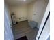 Utility room contains the hot water tank with a door at 15233 Omaha St, Hudson, FL 34667