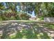 Expansive backyard featuring a mix of lush greenery and a well maintained lawn at 1526 Ewing St, Nokomis, FL 34275