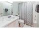 Clean bathroom featuring tile, a single vanity, and a shower/tub combo, providing ample space and functionality at 1526 Ewing St, Nokomis, FL 34275