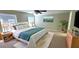 Bright bedroom featuring a king-size bed, plush rug, and ample natural light for a comfortable and relaxing retreat at 1526 Ewing St, Nokomis, FL 34275