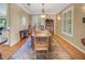 Inviting dining room with hardwood floors, traditional decor, and abundant natural light perfect for Gathering meals at 1526 Ewing St, Nokomis, FL 34275