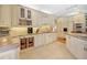 Bright, spacious kitchen featuring ample counter space, custom cabinetry, and modern appliances at 1526 Ewing St, Nokomis, FL 34275