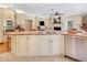 Open-concept kitchen with granite countertops, stainless steel appliances, and a seamless flow to the living area at 1526 Ewing St, Nokomis, FL 34275