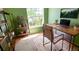 Bright office space with large window, wooden desk, and stylish decor at 1526 Ewing St, Nokomis, FL 34275