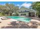 Inviting backyard with pool, hot tub, and a spacious patio area for relaxation at 1526 Ewing St, Nokomis, FL 34275