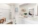 Bright bathroom featuring double sinks, a walk-in shower, and a modern design at 17417 Haysack Ter, Lakewood Ranch, FL 34211