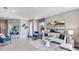 Spacious living room with stylish furnishings, decorative artwork, and plenty of natural light at 18113 Cropside Trl, Lakewood Ranch, FL 34211