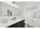 Bright bathroom features marble countertops, contemporary fixtures, stylish mirror, and decorative fish art at 18114 Gawthrop Dr # 402, Bradenton, FL 34211
