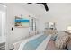 Well-appointed bedroom with a mounted TV and views of the lanai for relaxing evenings at 18114 Gawthrop Dr # 402, Bradenton, FL 34211