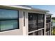 Exterior view showcasing a screened-in lanai offering a private outdoor retreat at 18114 Gawthrop Dr # 402, Bradenton, FL 34211