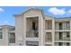 A close exterior view of an upscale condo featuring private entry staircases at 18114 Gawthrop Dr # 402, Bradenton, FL 34211