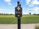 A sign reading 'Hole 1' with an arrow points the way on the golf course at 18114 Gawthrop Dr # 402, Bradenton, FL 34211
