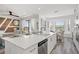 Open-concept kitchen with a large island, eat-in dining space, and a view of the living area at 18114 Gawthrop Dr # 402, Bradenton, FL 34211