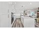 Spacious kitchen boasts ample cabinet space, stainless steel appliances, and a large center island at 18114 Gawthrop Dr # 402, Bradenton, FL 34211