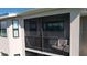 A covered lanai features screens and railing for relaxing outdoors at 18114 Gawthrop Dr # 402, Bradenton, FL 34211