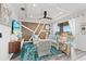 Inviting living room with tray ceiling, designer furnishings, a cozy rug, and a view of the outside scenery at 18114 Gawthrop Dr # 402, Bradenton, FL 34211