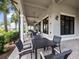 A view of the covered outdoor seating area with tables and chairs at 18114 Gawthrop Dr # 402, Bradenton, FL 34211