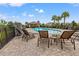 Community swimming pool with many chairs for residents to relax at 18114 Gawthrop Dr # 402, Bradenton, FL 34211